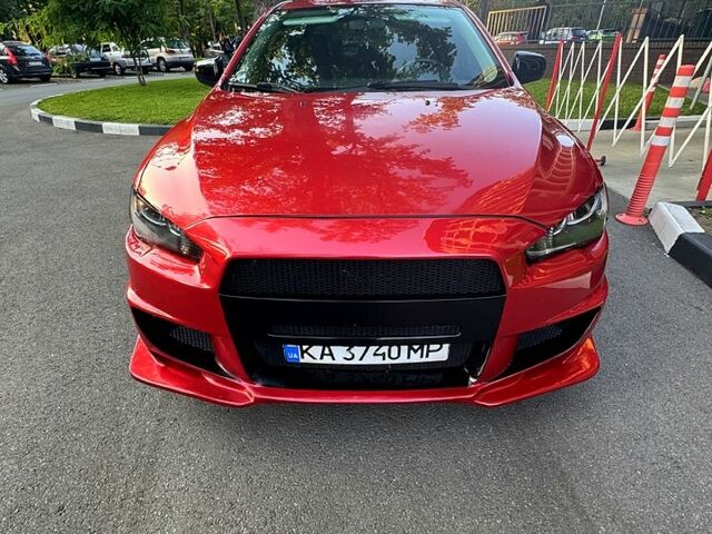 Красный Мицубиси Лансер, объемом двигателя 2 л и пробегом 260 тыс. км за 7300 $, фото 2 на Automoto.ua