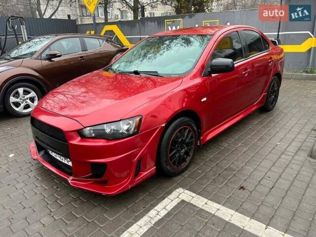 Красный Мицубиси Лансер, объемом двигателя 2 л и пробегом 230 тыс. км за 6700 $, фото 3 на Automoto.ua