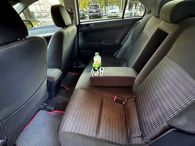 Мицубиси Лансер 2012 в Харькове на Automoto.ua Красный Мицубиси Лансер, объемом двигателя 2 л и пробегом 260 тыс. км за 6900 $, фото 4 на Automoto.ua