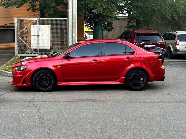 Красный Мицубиси Лансер, объемом двигателя 2 л и пробегом 260 тыс. км за 7300 $, фото 3 на Automoto.ua