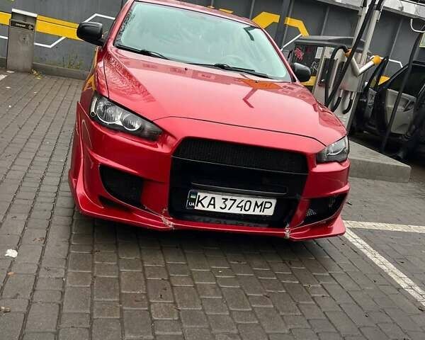 Красный Мицубиси Лансер, объемом двигателя 2 л и пробегом 230 тыс. км за 6700 $, фото 5 на Automoto.ua