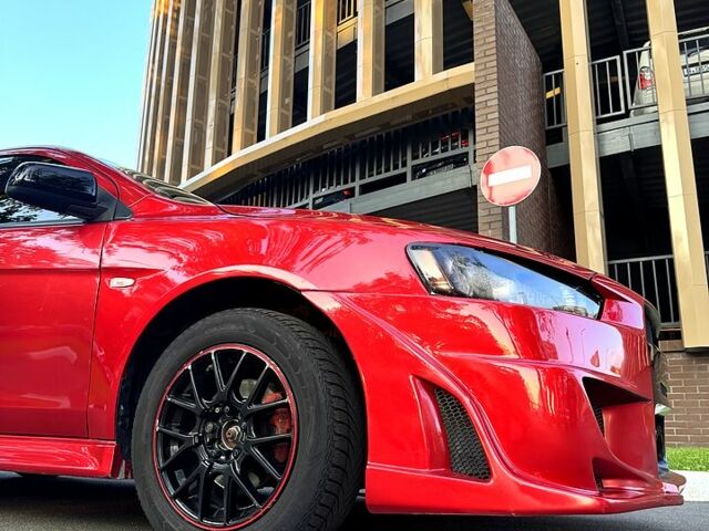 Мицубиси Лансер 2012 в Харькове на Automoto.ua Красный Мицубиси Лансер, объемом двигателя 2 л и пробегом 260 тыс. км за 6900 $, фото 1 на Automoto.ua