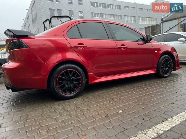 Красный Мицубиси Лансер, объемом двигателя 2 л и пробегом 230 тыс. км за 6700 $, фото 6 на Automoto.ua