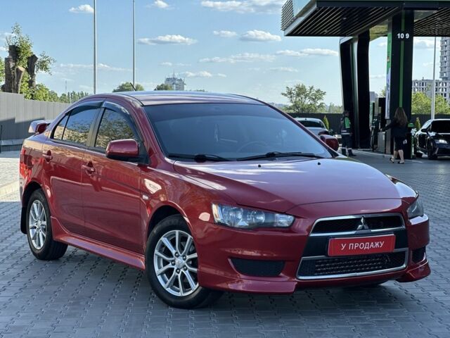 Красный Мицубиси Лансер, объемом двигателя 2 л и пробегом 185 тыс. км за 8699 $, фото 5 на Automoto.ua