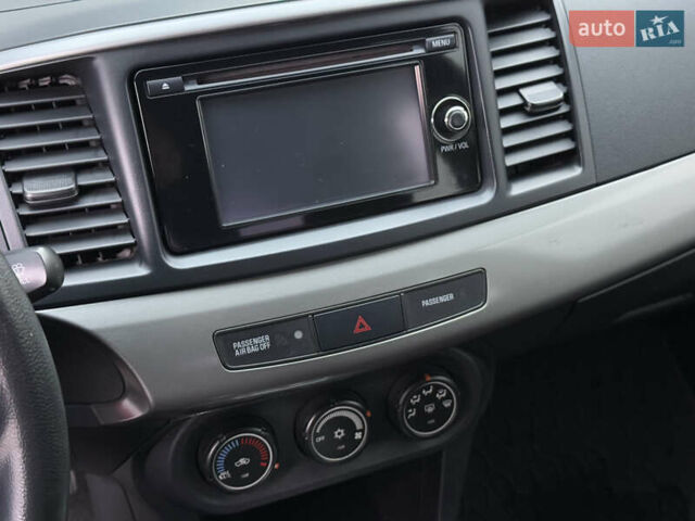 Червоний Міцубісі Lancer, об'ємом двигуна 2.36 л та пробігом 175 тис. км за 7999 $, фото 15 на Automoto.ua