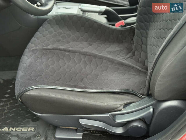 Червоний Міцубісі Lancer, об'ємом двигуна 2.36 л та пробігом 175 тис. км за 7999 $, фото 9 на Automoto.ua