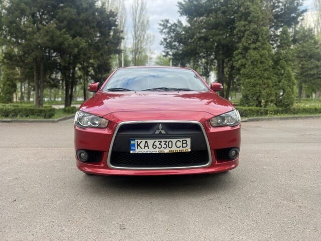 Червоний Міцубісі Lancer, об'ємом двигуна 2 л та пробігом 190 тис. км за 8500 $, фото 1 на Automoto.ua