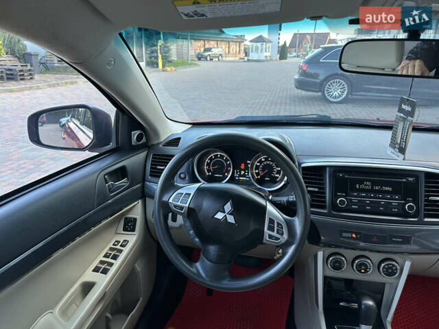 Красный Мицубиси Лансер, объемом двигателя 2 л и пробегом 230 тыс. км за 9250 $, фото 42 на Automoto.ua