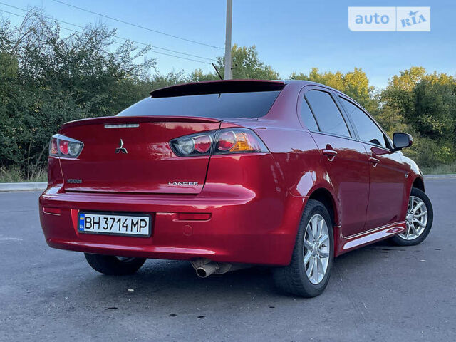 Червоний Міцубісі Lancer, об'ємом двигуна 2 л та пробігом 140 тис. км за 9900 $, фото 31 на Automoto.ua