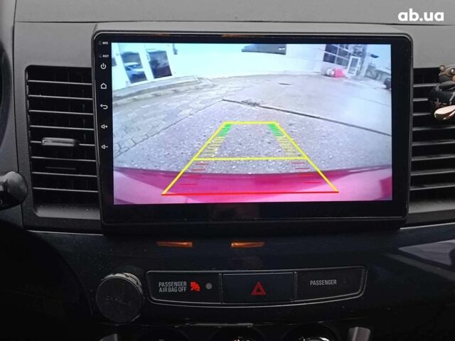 Красный Мицубиси Лансер, объемом двигателя 2 л и пробегом 136 тыс. км за 10990 $, фото 23 на Automoto.ua