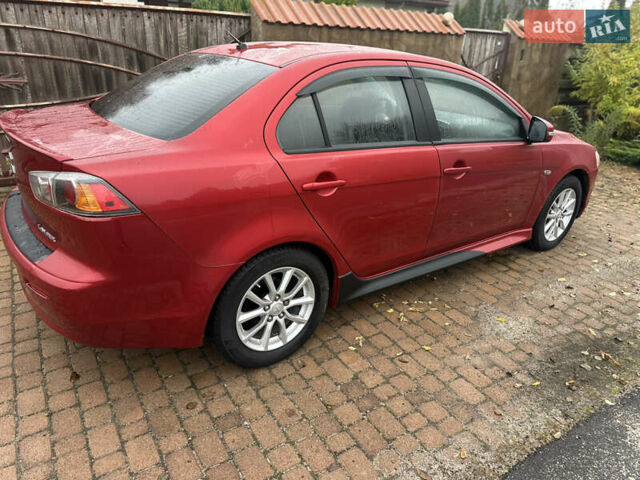 Красный Мицубиси Лансер, объемом двигателя 2 л и пробегом 70 тыс. км за 7950 $, фото 1 на Automoto.ua
