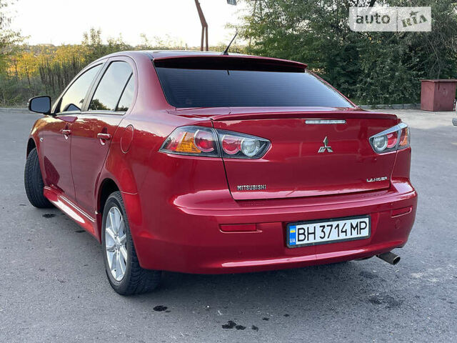 Червоний Міцубісі Lancer, об'ємом двигуна 2 л та пробігом 140 тис. км за 9900 $, фото 16 на Automoto.ua