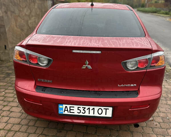 Красный Мицубиси Лансер, объемом двигателя 2 л и пробегом 70 тыс. км за 7950 $, фото 2 на Automoto.ua