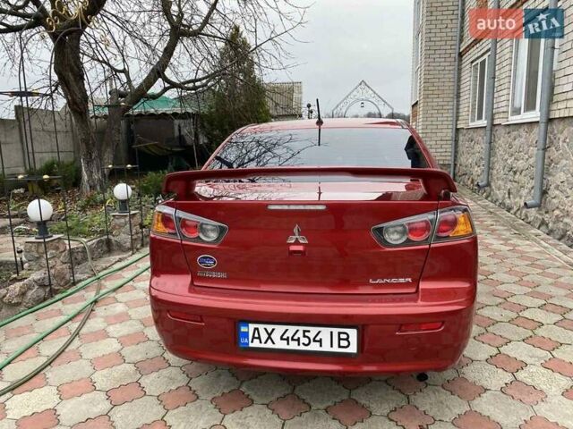 Красный Мицубиси Лансер, объемом двигателя 2 л и пробегом 134 тыс. км за 10500 $, фото 7 на Automoto.ua