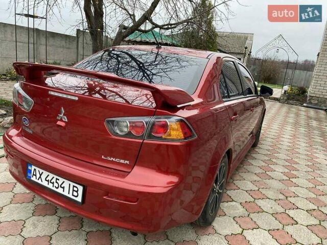 Красный Мицубиси Лансер, объемом двигателя 2 л и пробегом 134 тыс. км за 10500 $, фото 6 на Automoto.ua