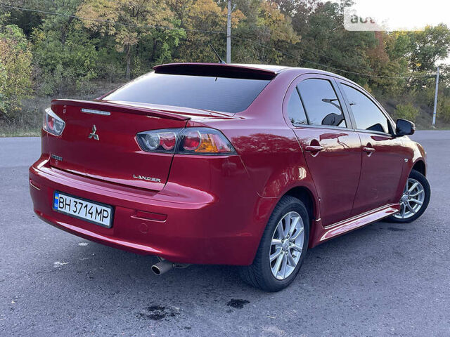 Червоний Міцубісі Lancer, об'ємом двигуна 2 л та пробігом 140 тис. км за 9900 $, фото 14 на Automoto.ua