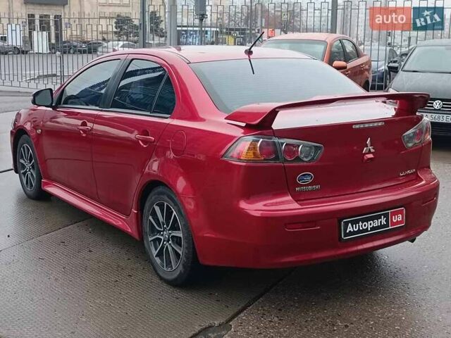 Червоний Міцубісі Lancer, об'ємом двигуна 2 л та пробігом 136 тис. км за 10990 $, фото 6 на Automoto.ua