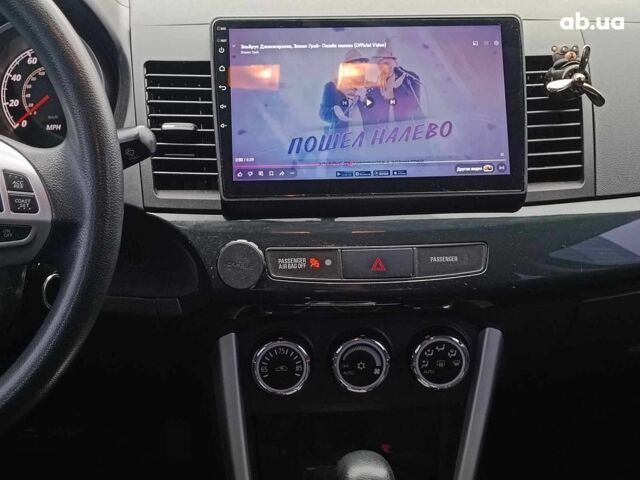 Красный Мицубиси Лансер, объемом двигателя 2 л и пробегом 136 тыс. км за 10990 $, фото 26 на Automoto.ua