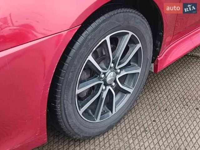 Червоний Міцубісі Lancer, об'ємом двигуна 2 л та пробігом 136 тис. км за 10990 $, фото 5 на Automoto.ua