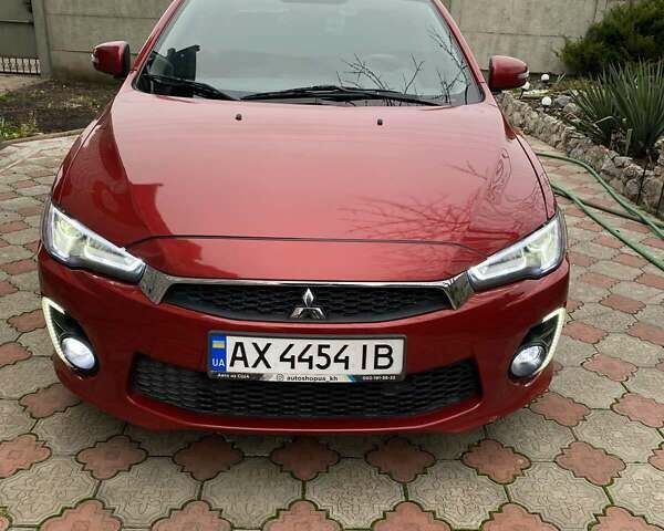 Красный Мицубиси Лансер, объемом двигателя 2 л и пробегом 134 тыс. км за 10500 $, фото 1 на Automoto.ua