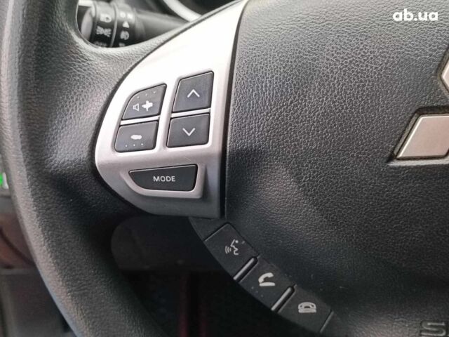 Красный Мицубиси Лансер, объемом двигателя 2 л и пробегом 136 тыс. км за 10990 $, фото 19 на Automoto.ua