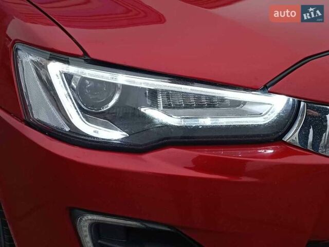 Червоний Міцубісі Lancer, об'ємом двигуна 2 л та пробігом 136 тис. км за 10990 $, фото 3 на Automoto.ua