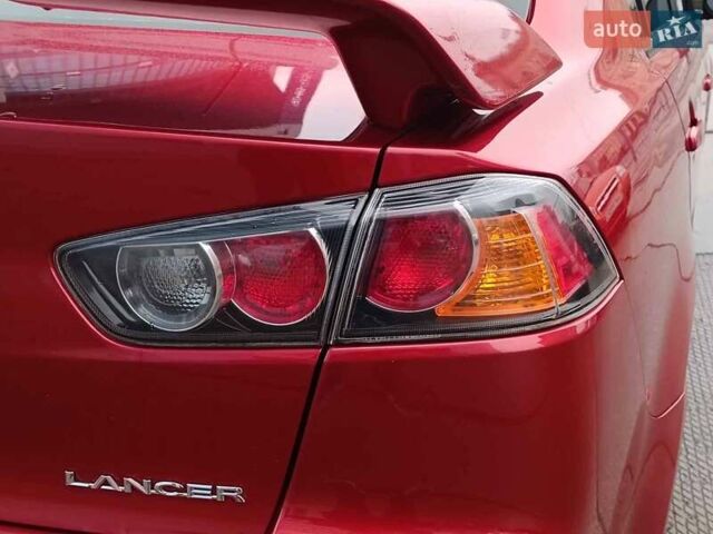 Червоний Міцубісі Lancer, об'ємом двигуна 2 л та пробігом 136 тис. км за 10990 $, фото 9 на Automoto.ua