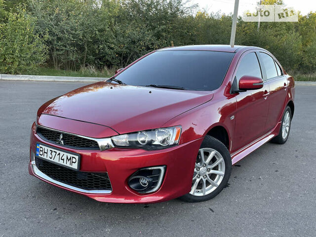 Червоний Міцубісі Lancer, об'ємом двигуна 2 л та пробігом 140 тис. км за 9900 $, фото 1 на Automoto.ua