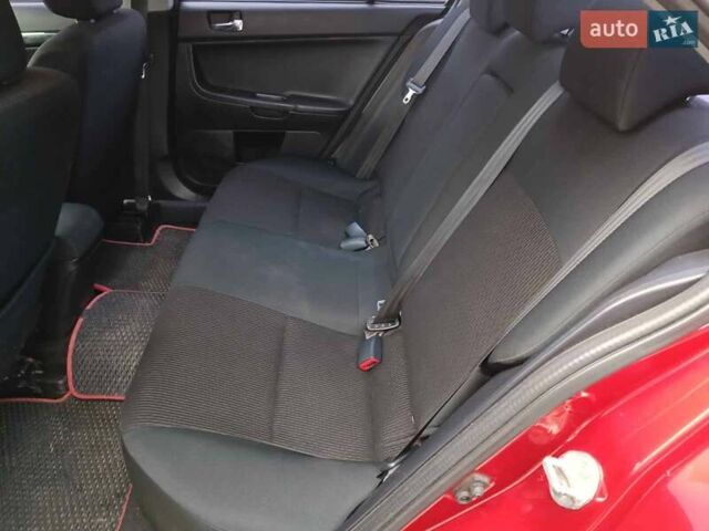 Червоний Міцубісі Lancer, об'ємом двигуна 2 л та пробігом 136 тис. км за 10990 $, фото 11 на Automoto.ua
