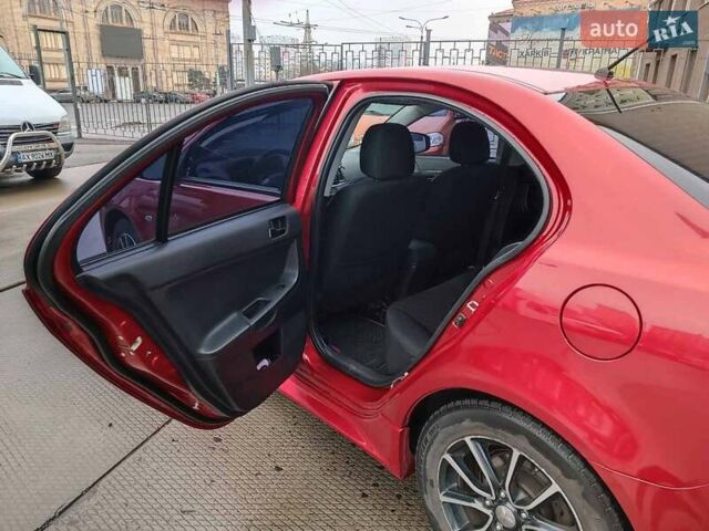 Червоний Міцубісі Lancer, об'ємом двигуна 2 л та пробігом 136 тис. км за 10990 $, фото 12 на Automoto.ua