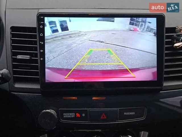 Червоний Міцубісі Lancer, об'ємом двигуна 2 л та пробігом 136 тис. км за 10990 $, фото 23 на Automoto.ua