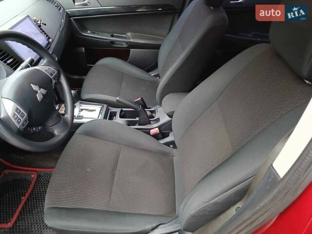Червоний Міцубісі Lancer, об'ємом двигуна 2 л та пробігом 136 тис. км за 10990 $, фото 15 на Automoto.ua