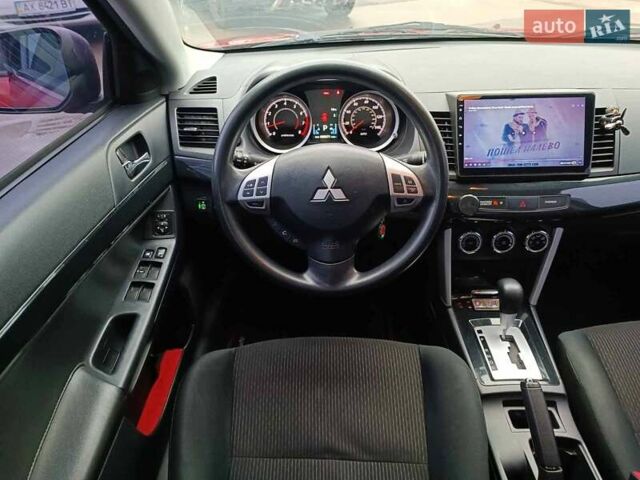 Червоний Міцубісі Lancer, об'ємом двигуна 2 л та пробігом 136 тис. км за 10990 $, фото 26 на Automoto.ua