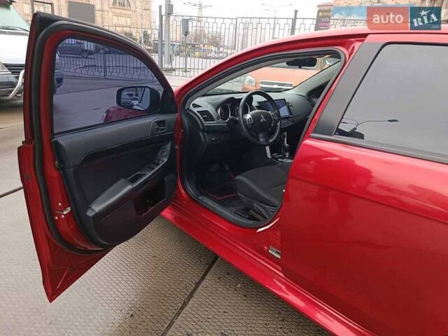Червоний Міцубісі Lancer, об'ємом двигуна 2 л та пробігом 136 тис. км за 10990 $, фото 13 на Automoto.ua