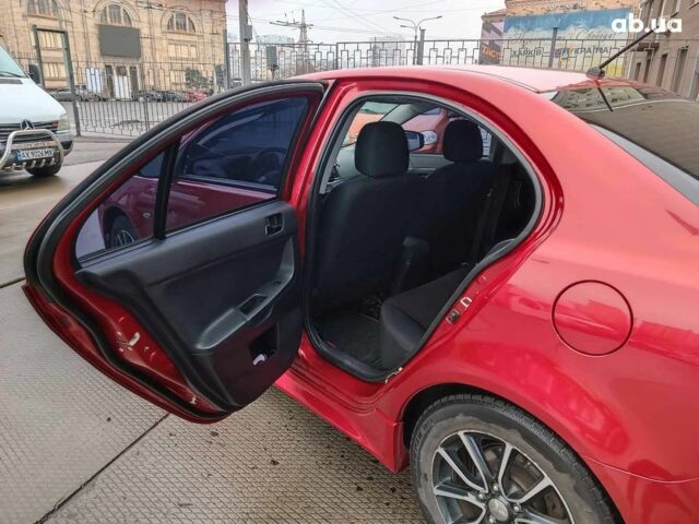 Красный Мицубиси Лансер, объемом двигателя 2 л и пробегом 136 тыс. км за 10990 $, фото 12 на Automoto.ua