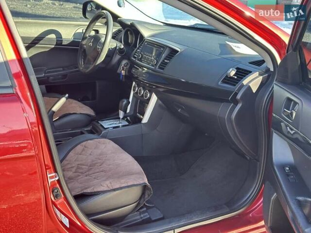 Червоний Міцубісі Lancer, об'ємом двигуна 2 л та пробігом 198 тис. км за 9690 $, фото 21 на Automoto.ua