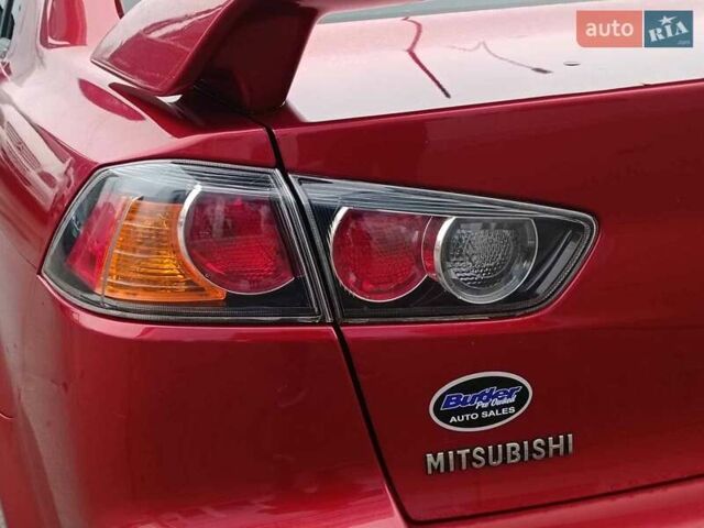 Червоний Міцубісі Lancer, об'ємом двигуна 2 л та пробігом 136 тис. км за 10990 $, фото 7 на Automoto.ua