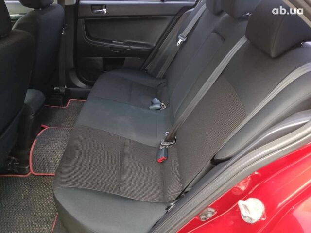 Красный Мицубиси Лансер, объемом двигателя 2 л и пробегом 136 тыс. км за 10990 $, фото 11 на Automoto.ua