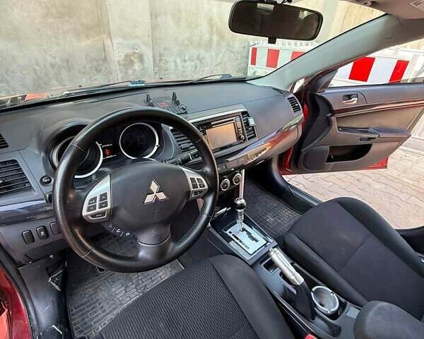 Красный Мицубиси Лансер, объемом двигателя 2 л и пробегом 145 тыс. км за 9000 $, фото 9 на Automoto.ua