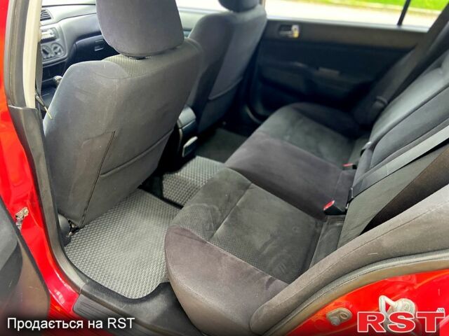 Красный Мицубиси Лансер, объемом двигателя 1.6 л и пробегом 214 тыс. км за 3999 $, фото 7 на Automoto.ua