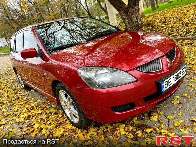 Красный Мицубиси Лансер, объемом двигателя 1.6 л и пробегом 214 тыс. км за 3999 $, фото 2 на Automoto.ua