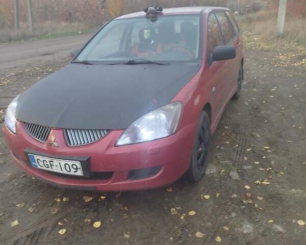 Красный Мицубиси Лансер, объемом двигателя 1.6 л и пробегом 260 тыс. км за 3000 $, фото 3 на Automoto.ua
