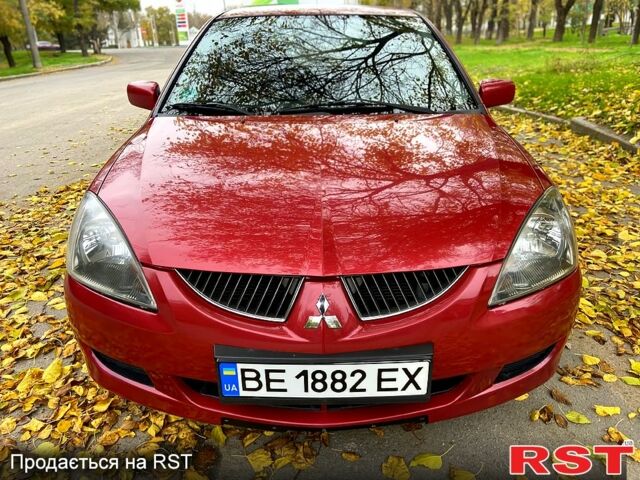 Красный Мицубиси Лансер, объемом двигателя 1.6 л и пробегом 214 тыс. км за 3999 $, фото 1 на Automoto.ua