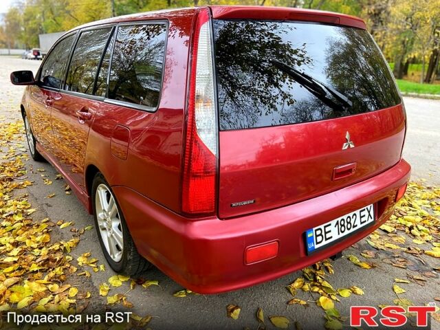 Красный Мицубиси Лансер, объемом двигателя 1.6 л и пробегом 214 тыс. км за 3999 $, фото 5 на Automoto.ua