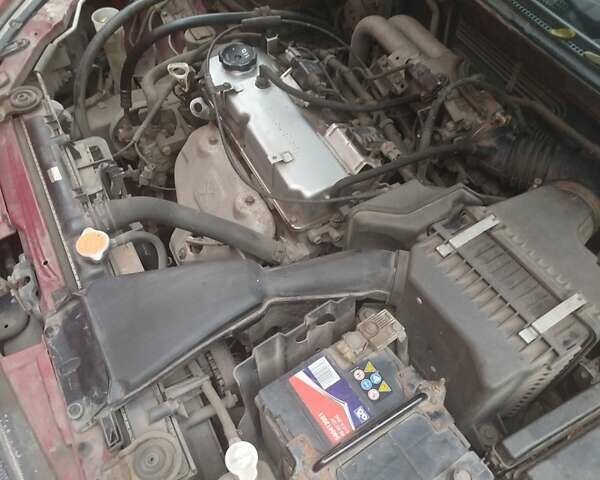 Красный Мицубиси Лансер, объемом двигателя 1.6 л и пробегом 260 тыс. км за 3000 $, фото 4 на Automoto.ua