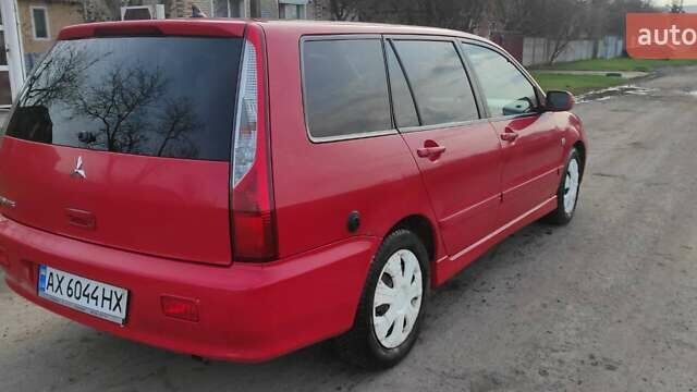 Красный Мицубиси Лансер, объемом двигателя 2 л и пробегом 200 тыс. км за 4500 $, фото 4 на Automoto.ua