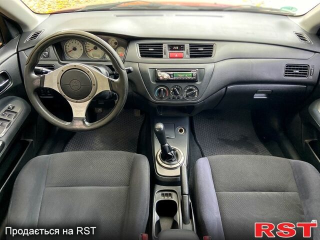 Красный Мицубиси Лансер, объемом двигателя 1.6 л и пробегом 214 тыс. км за 3999 $, фото 9 на Automoto.ua