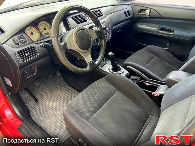 Красный Мицубиси Лансер, объемом двигателя 1.6 л и пробегом 214 тыс. км за 3999 $, фото 6 на Automoto.ua