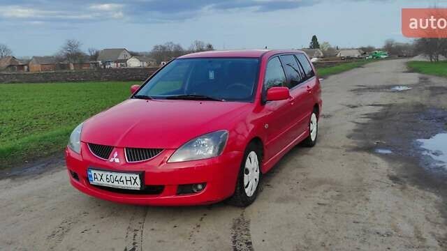 Красный Мицубиси Лансер, объемом двигателя 2 л и пробегом 200 тыс. км за 4500 $, фото 2 на Automoto.ua