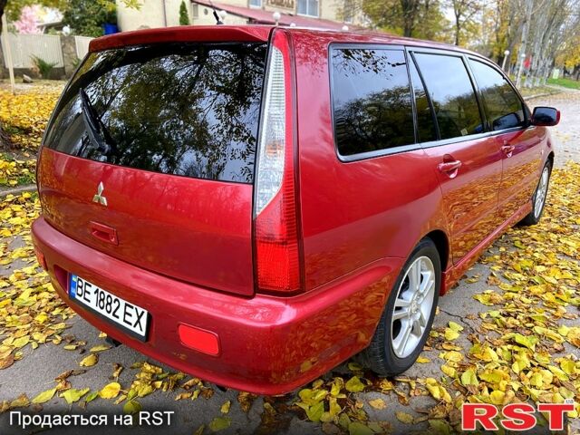 Красный Мицубиси Лансер, объемом двигателя 1.6 л и пробегом 214 тыс. км за 3999 $, фото 3 на Automoto.ua